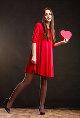 Woman holding heart shaped gift box
