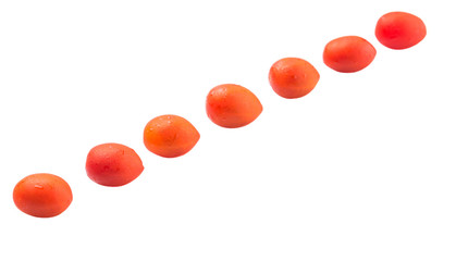Bite sized red cherry grape tomato over white background