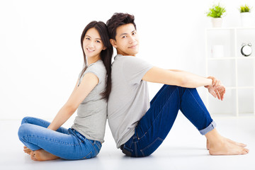 Young happy couple sitting together
