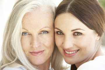 Portrait Of Mature Mother  Relaxing With Grown Up Daughter