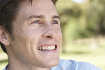 Portrait Of Young Man Relaxing In Park