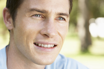 Portrait Of Young Man Relaxing In Park
