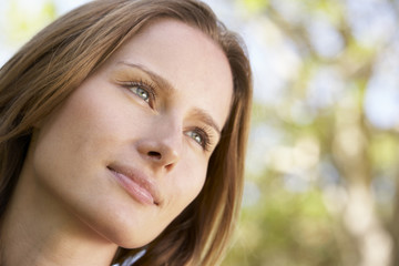 Portrait Of Thoughtful Young Woman Outdoors