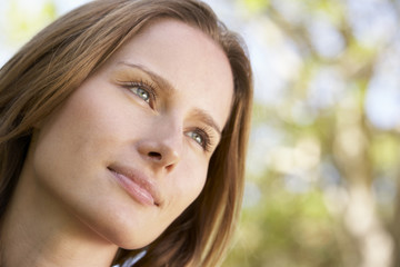 Fototapeta premium Portrait Of Thoughtful Young Woman Outdoors