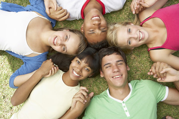 Group Of Teenage Friends Having Fun In Park