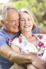 Portrait Of Senior Couple Relaxing In Countryside