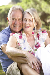 Fototapeta premium Portrait Of Senior Couple Relaxing In Countryside