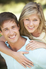 Young Couple Having Fun In Countryside Together