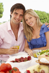 Young Couple Enjoying Outdoor Meal Together