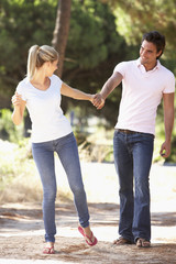 Young Couple On Romantic Walk In Countryside