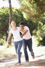 Young Couple On Romantic Walk In Countryside