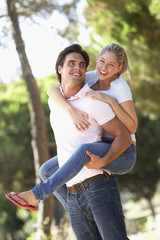 Young Couple Having Fun On Countryside Walk