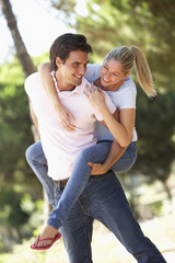 Young Couple Having Fun On Countryside Walk