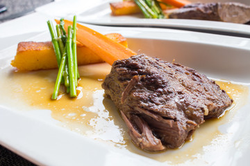 Delicious stew beef on a plate  - soft focus