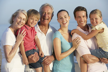 Portrait Of Three Generation Family On Beach Holiday