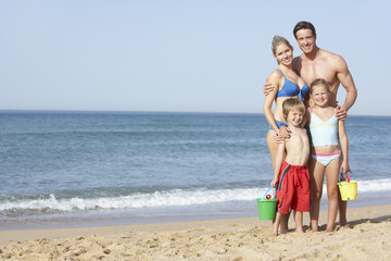 Fototapeta na wymiar Portrait Of Family Enjoying Beach Holiday
