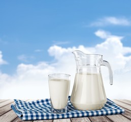 Milk, glass, tablecloth.