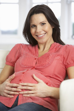 Pregnant Woman Relaxing At Home
