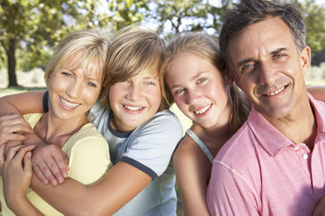 Fototapeta premium Middle Aged Family In Field In Countryside