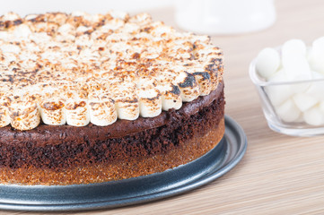 freshly bake smores cake with toasted marshmallows on top