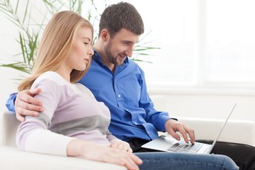 Laptop, man, living room.