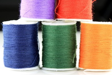 Colorful miniature spools of thread for sewing