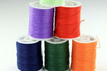 Colorful miniature spools of thread for sewing