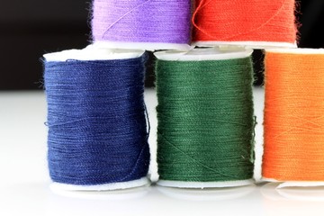 Colorful miniature spools of thread for sewing