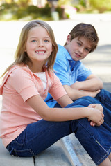 Young girl and boy outdoors