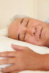 Fototapeta na wymiar Senior Taiwanese man sleeping