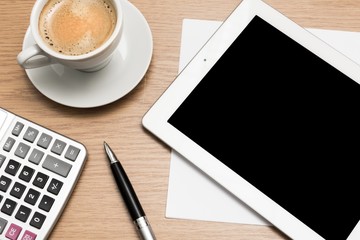 Tablet, desk, laptop.