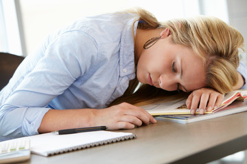 Teenage girl asleep in class