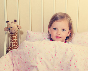 Fototapeta na wymiar Beautiful little girl in the crib.