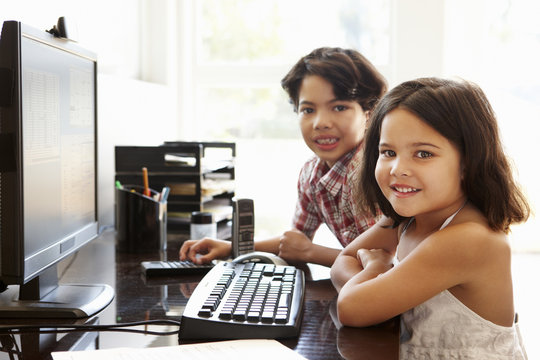 Hispanic children using computer at home
