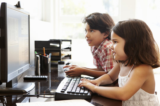Hispanic children using computer at home