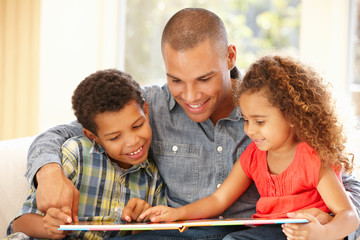 Father reading to children - Powered by Adobe