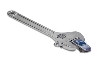 Obraz premium Adjustable wrench and a toy car