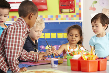 Group Of Elementary Age Schoolchildren In Art Class