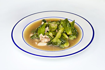 Fried lettuce with pork isokated on white background