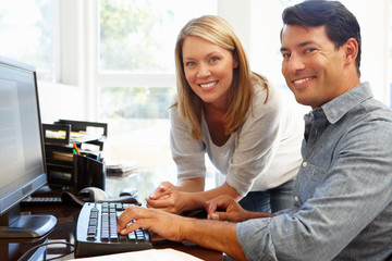 Couple working in home office