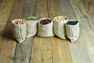 Beans on vintage wooden boards still life