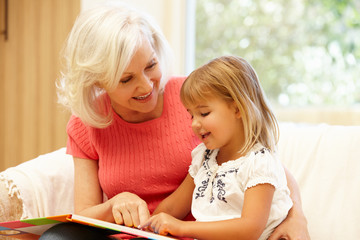 Fototapeta premium Grandmother and granddaughter reading