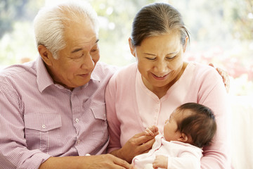 Asian grandparents with baby