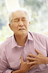 Senior Asian man with chest pain