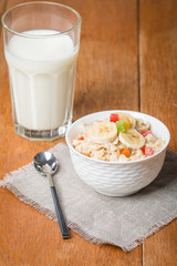 Oatmeal with candied fruils and milk