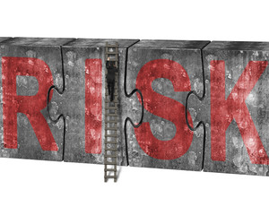 Man climbing ladder puzzles concrete wall red risk word