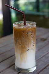 Iced coffee with milk is on the table.