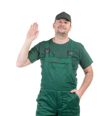 Worker in green overalls.