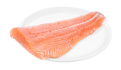 Raw salmon fillet on plate.