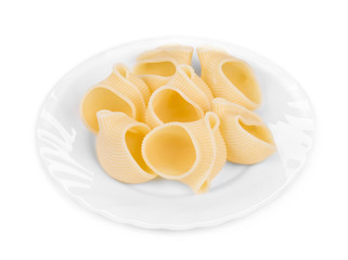 Italian pasta shells on a white plate.